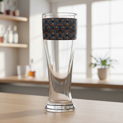 Burnished Slate pilsner beer glass with slate blue and copper design on a wooden table in a kitchen setting