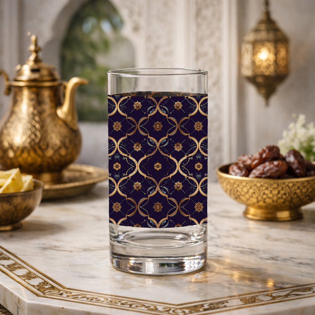 Midnight Marrakech highball glass with a violet and gold design on a marble table with Moroccan decorative items.
