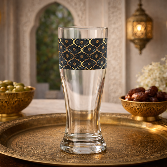 Midnight Marrakech pilsner beer glass with a violet and gold design sitting on a tray in an elegant Moroccan setting