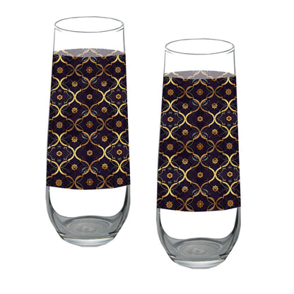 Two stemless champagne glasses with a violet and gold wrap design on a white background