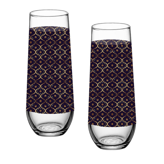 Two stemless champagne glasses with a violet and gold wrap design on a white background